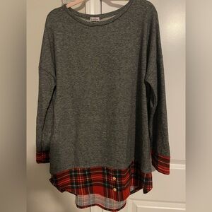 Stylish sweater with plaid details.